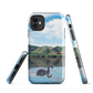 Phone case with a black swan on a calm lake, New Zealand hills in the background. Art by NZ designer Ben Hart.