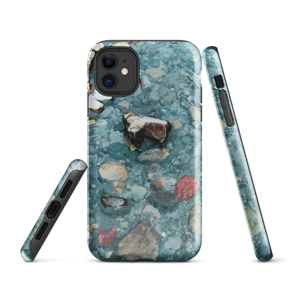 Washed Away designer phone case with abstract river stone artwork in earthy blues and natural tones.