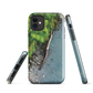 Resting Place phone case with aerial artwork of river rocks, green bush, and driftwood in a New Zealand stream.