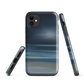 Dark abstract phone case with blue and grey streaks and glossy finish.