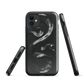 Phone case with detailed black python design on dark background.