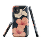 Phone case with coral hibiscus flowers and ivory blooms on dark background