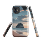 Phone case with Cathedral Cove beach and sunset scene, featuring soft skies and sea stack