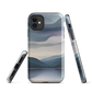 Phone case with moody blue and purple layered mountain and lake landscape artwork