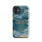 Nature-inspired phone case featuring a dragonfly over calm water with blue and green forest tones.