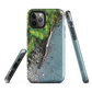 Resting Place phone case with aerial artwork of river rocks, green bush, and driftwood in a New Zealand stream.