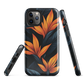 Phone case with bold orange bird of paradise flowers on dark background.