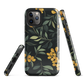 NZ Kowhai phone case with native yellow floral and green leaves on black background by designer Ben Hart.