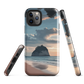 Phone case with Cathedral Cove beach and sunset scene, featuring soft skies and sea stack