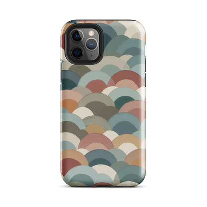 A soft retro-inspired phone case featuring layered arc shapes in warm, earthy tones.
