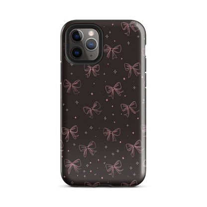 Midnight Bow seamless repeat pattern — pink hand-drawn ribbon bows and sparkle stars on a black background
