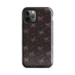Midnight Bow seamless repeat pattern — pink hand-drawn ribbon bows and sparkle stars on a black background