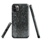 Dark damask patterned phone case with a vintage gothic aesthetic and textured stone background.