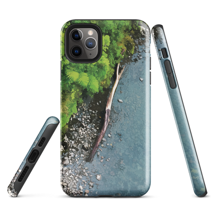 Resting Place phone case with aerial artwork of river rocks, green bush, and driftwood in a New Zealand stream.