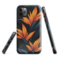 Phone case with bold orange bird of paradise flowers on dark background.