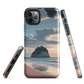 Phone case with Cathedral Cove beach and sunset scene, featuring soft skies and sea stack