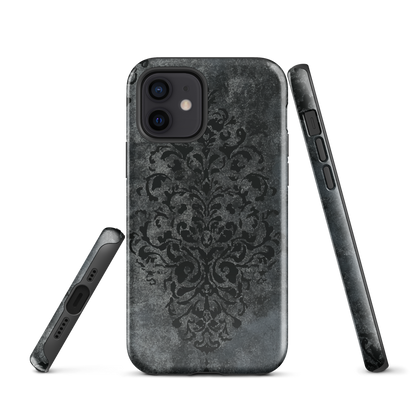 Dark damask patterned phone case with a vintage gothic aesthetic and textured stone background.