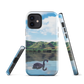 Phone case with a black swan on a calm lake, New Zealand hills in the background. Art by NZ designer Ben Hart.