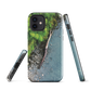 Resting Place phone case with aerial artwork of river rocks, green bush, and driftwood in a New Zealand stream.