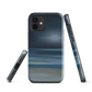 Dark abstract phone case with blue and grey streaks and glossy finish.