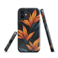Phone case with bold orange bird of paradise flowers on dark background.