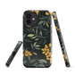 NZ Kowhai phone case with native yellow floral and green leaves on black background by designer Ben Hart.