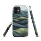 Phone case with layered mountain and forest landscape in blue and green hues