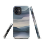 Phone case with moody blue and purple layered mountain and lake landscape artwork