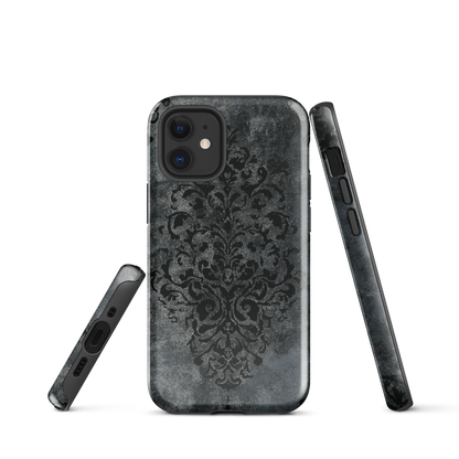 Dark damask patterned phone case with a vintage gothic aesthetic and textured stone background.