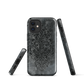Dark damask patterned phone case with a vintage gothic aesthetic and textured stone background.
