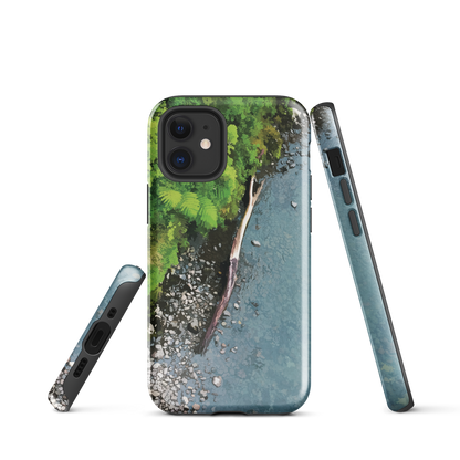 Resting Place phone case with aerial artwork of river rocks, green bush, and driftwood in a New Zealand stream.