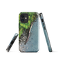Resting Place phone case with aerial artwork of river rocks, green bush, and driftwood in a New Zealand stream.