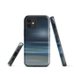 Dark abstract phone case with blue and grey streaks and glossy finish.