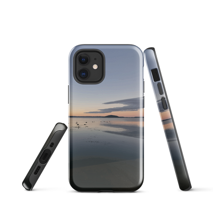 Phone case with tranquil lake scene at sunrise and distant hills.