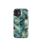 Modern abstract geometric phone case in teal and blue tones with layered retro-inspired shapes.