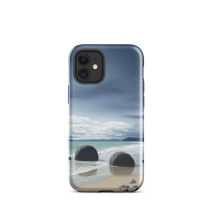 Moeraki Boulders coastal designer phone case with ocean waves and dramatic NZ sky