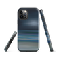 Dark abstract phone case with blue and grey streaks and glossy finish.