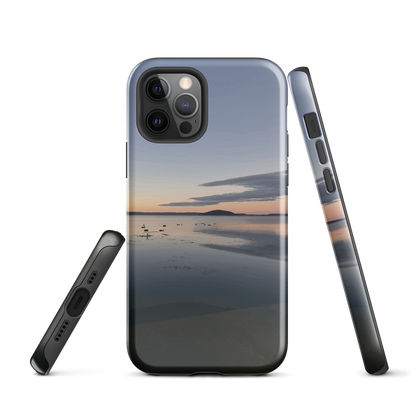Phone case with tranquil lake scene at sunrise and distant hills.