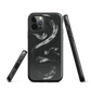 Phone case with detailed black python design on dark background.