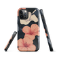 Phone case with coral hibiscus flowers and ivory blooms on dark background