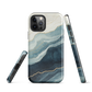 An elegant abstract phone case inspired by layered coastal forms in blue and teal tones.