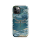 Nature-inspired phone case featuring a dragonfly over calm water with blue and green forest tones.