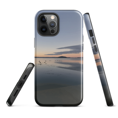 Phone case with tranquil lake scene at sunrise and distant hills.