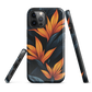 Phone case with bold orange bird of paradise flowers on dark background.