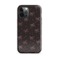 Midnight Bow seamless repeat pattern — pink hand-drawn ribbon bows and sparkle stars on a black background