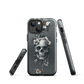 Gothic phone case with a floral skull design in grey tones, featuring white blossoms and dark detailing.