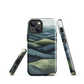 Phone case with layered mountain and forest landscape in blue and green hues