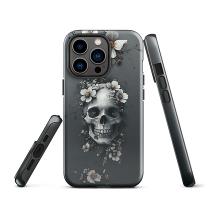 Gothic phone case with a floral skull design in grey tones, featuring white blossoms and dark detailing.