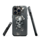 Gothic phone case with a floral skull design in grey tones, featuring white blossoms and dark detailing.