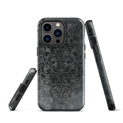 Dark damask patterned phone case with a vintage gothic aesthetic and textured stone background.